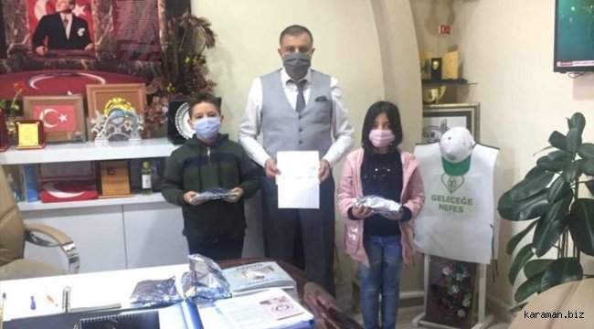 Tomarzalı minik öğrenciler haçlıklarını depremzedelere gönderdiler